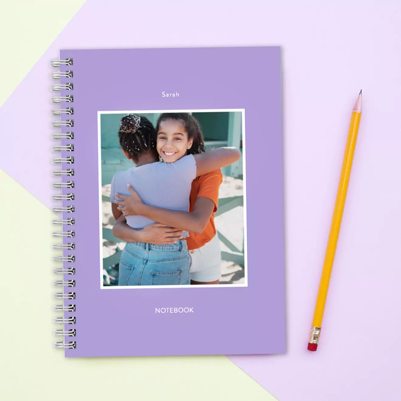 Notebook featuring a heartwarming photo of two school friends hugging, adding a personal and sentimental touch to the cover, perfect for capturing memories and school moments.