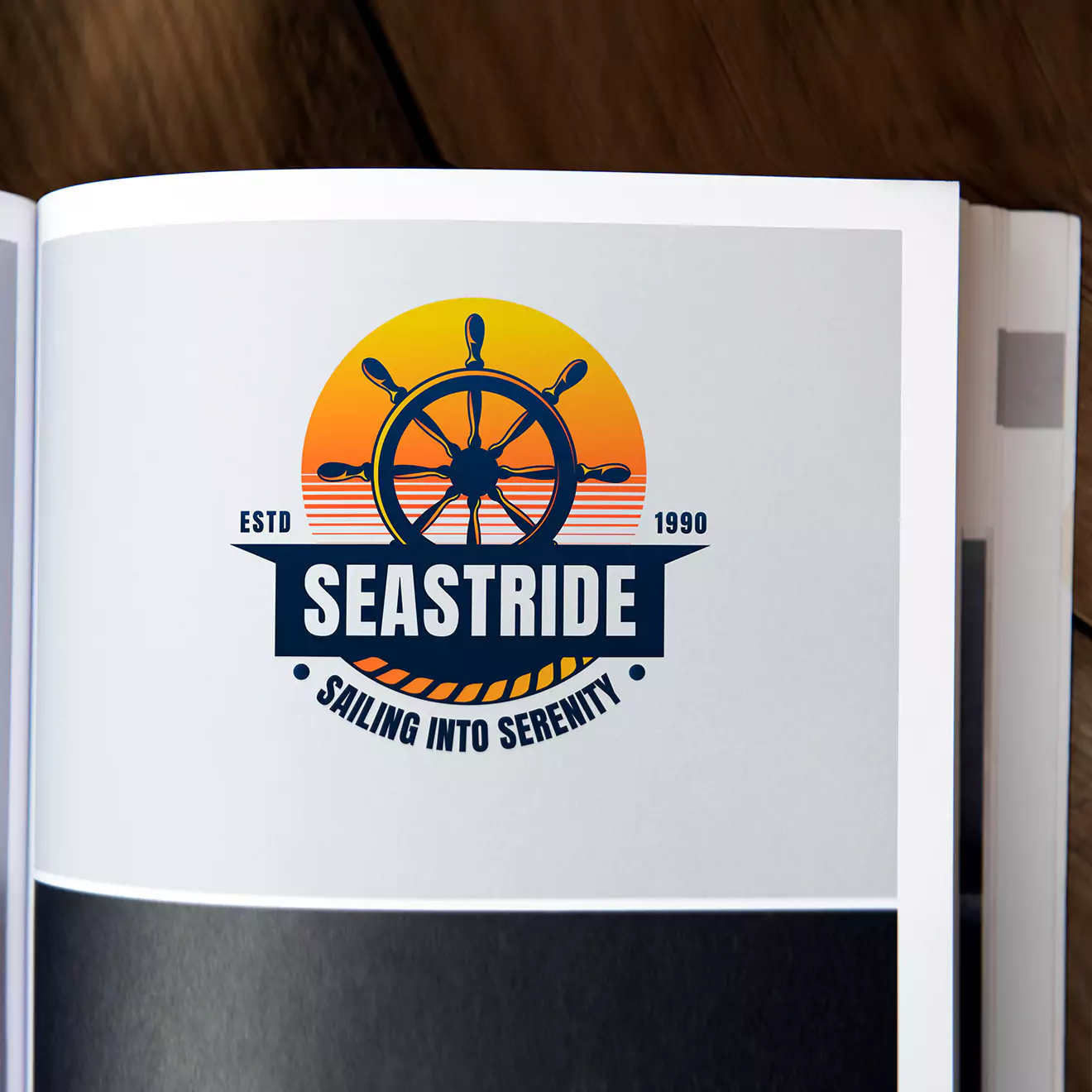 Open photobook displaying a page with a nautical-themed logo featuring a ship's wheel and the text 'Seastride - Sailing into Serenity' with an established date of 1990.