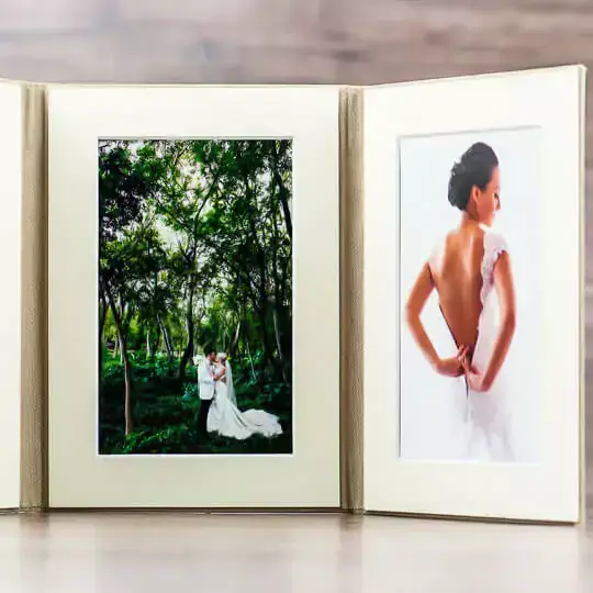 Romantic tri-fold frame with a trio of wedding photos, elegantly capturing the ceremony, the couple, and a celebratory moment, perfect for displaying love and unity.