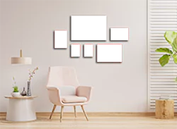 Six-piece canvas wall art set displayed in a modern living room with a light pink armchair, a small side table with decorative items, and a potted plant. The canvases vary in size and feature a cohesive colour scheme, making them ideal for personalised gifts or home decor.