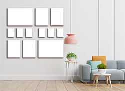 A stylish 12-piece canvas set displayed on a modern living room wall. The canvases vary in size and are arranged in a visually appealing layout. Ideal for personalised gifts, this set can be customised with favourite photos, making it perfect for occasions like Christmas, birthdays, or Valentine's Day.