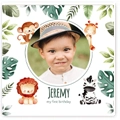 Baby safari-themed collage photobook cover featuring a central photo of a child surrounded by cute safari animals such as a lion, monkey, giraffe, and zebra, along with green tropical leaves. Personalised with the name 'Jeremy' and '1st Birthday' text. Ideal for baby shower gifts or personalised photo albums.