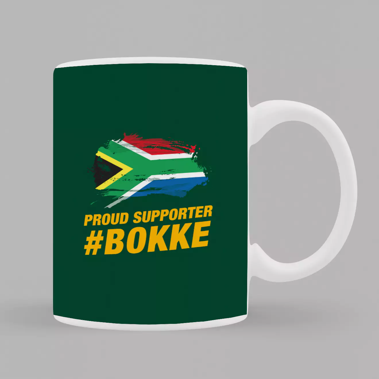 Green rugby supporter mug featuring the South African flag and the text 'Proud Supporter #Bokke' in bold yellow letters. Ideal for rugby fans and makes a great gift for men, dads, or boyfriends. Perfect for showing team spirit and support during matches.