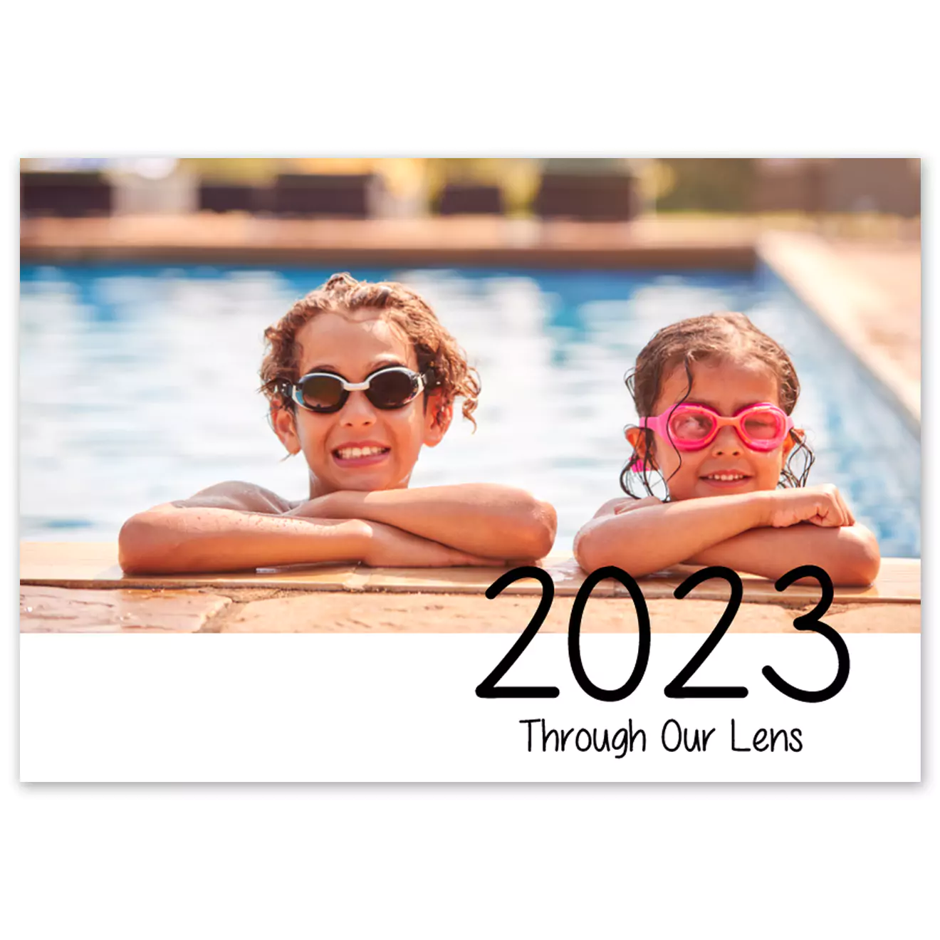 Hardcover photo book titled '2023 Our Highlights' featuring a cover image of two children wearing swimming goggles and leaning on the edge of a pool. Ideal for preserving memories, this photobook makes a perfect gift for various occasions such as Christmas, birthdays, and baby showers.