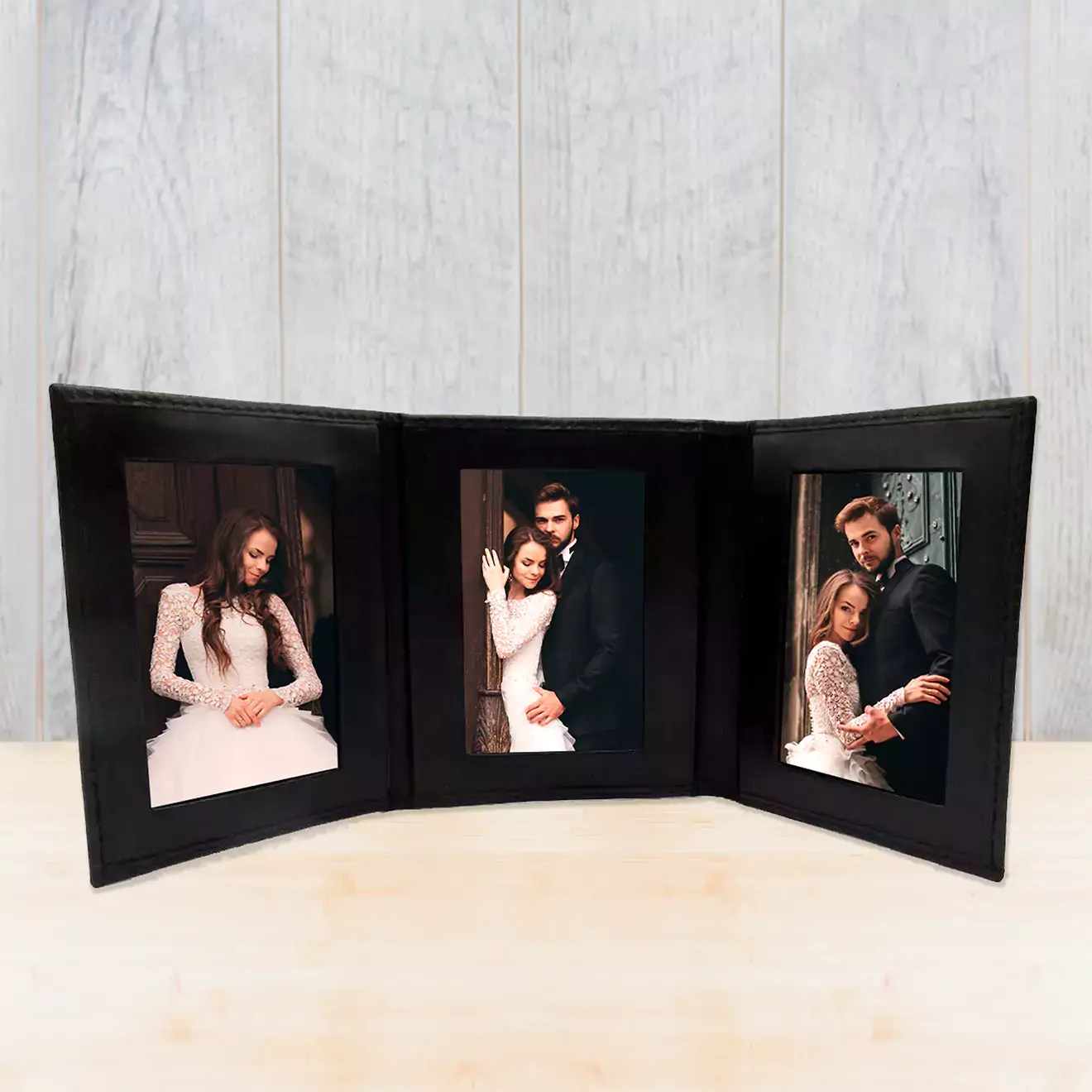 Image of a personalised tri-fold frame from RapidStudio, displaying a series of custom photos in a stylish, foldable format for easy showcasing.