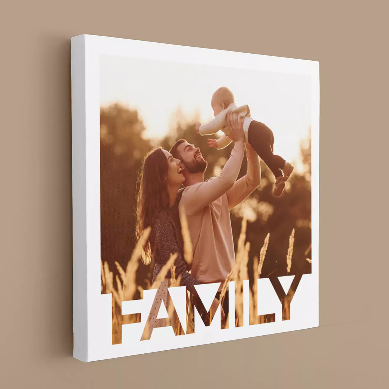 A man holding a personalised photo canvas featuring a smiling couple sitting outdoors. The canvas is vibrant and colourful, making it a perfect gift idea for various occasions such as birthdays, Christmas, or Valentine's Day. Ideal for personalised gifts in South Africa.