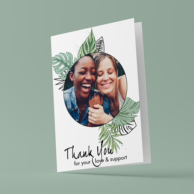 Thank you card featuring a circular photo of two smiling individuals surrounded by green leaves. The card has a white background with the text ''Thank You for your love & support'' written in elegant black script. Ideal for expressing gratitude and appreciation.