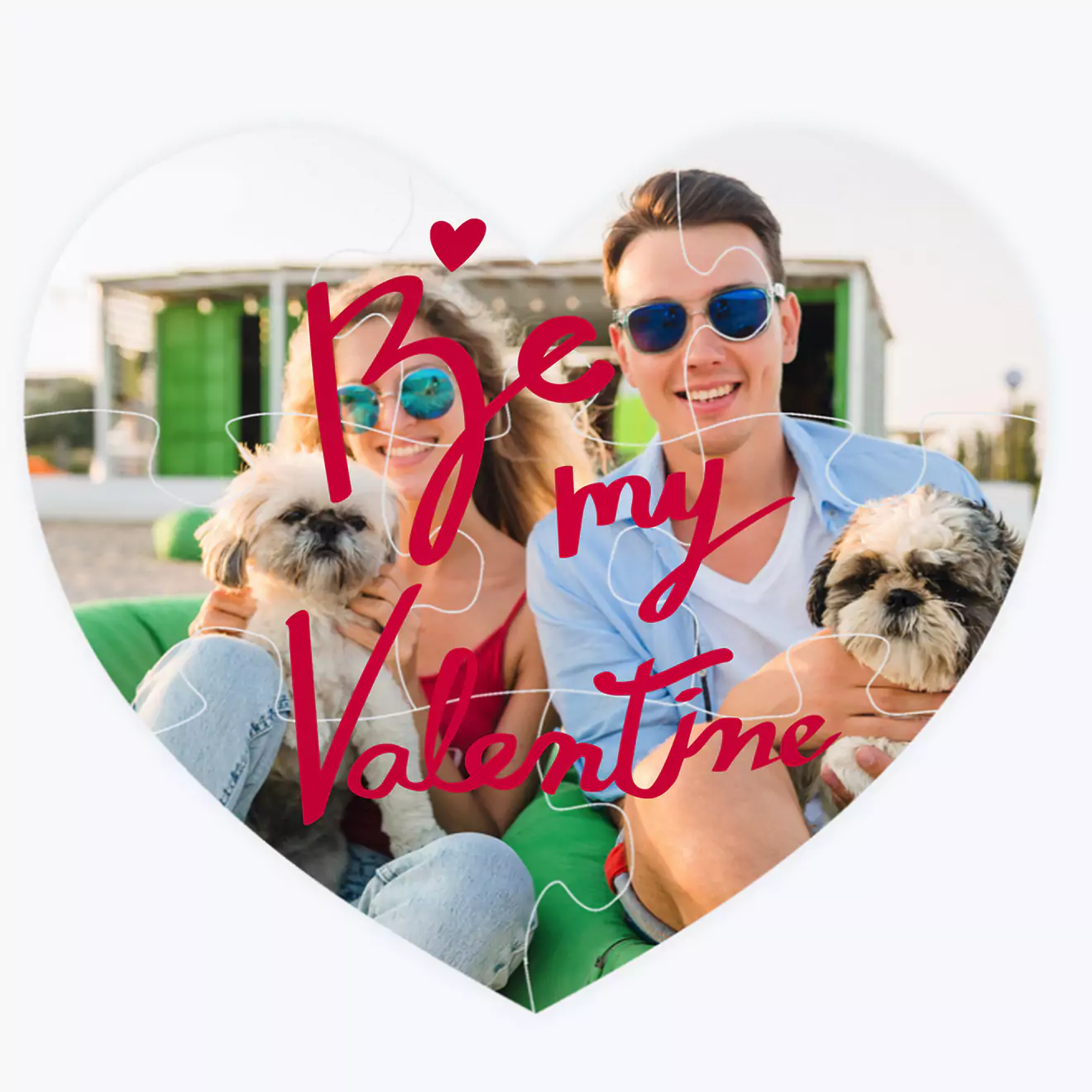 Heart-shaped personalised puzzle featuring a couple with two dogs, wearing sunglasses, and the text "Be my Valentine" in red cursive font. Ideal for Valentine's Day gift ideas, gifts for her, or gifts for boyfriend. Perfect for creating memorable and unique photo gifts in South Africa.